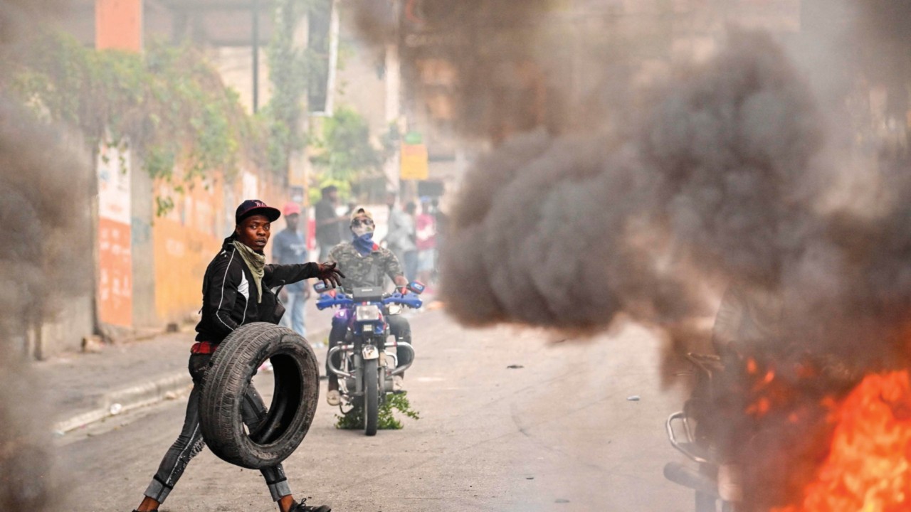 (FILES) A protester burns tires during a demonstration calling for the resignation of Prime Minister ...