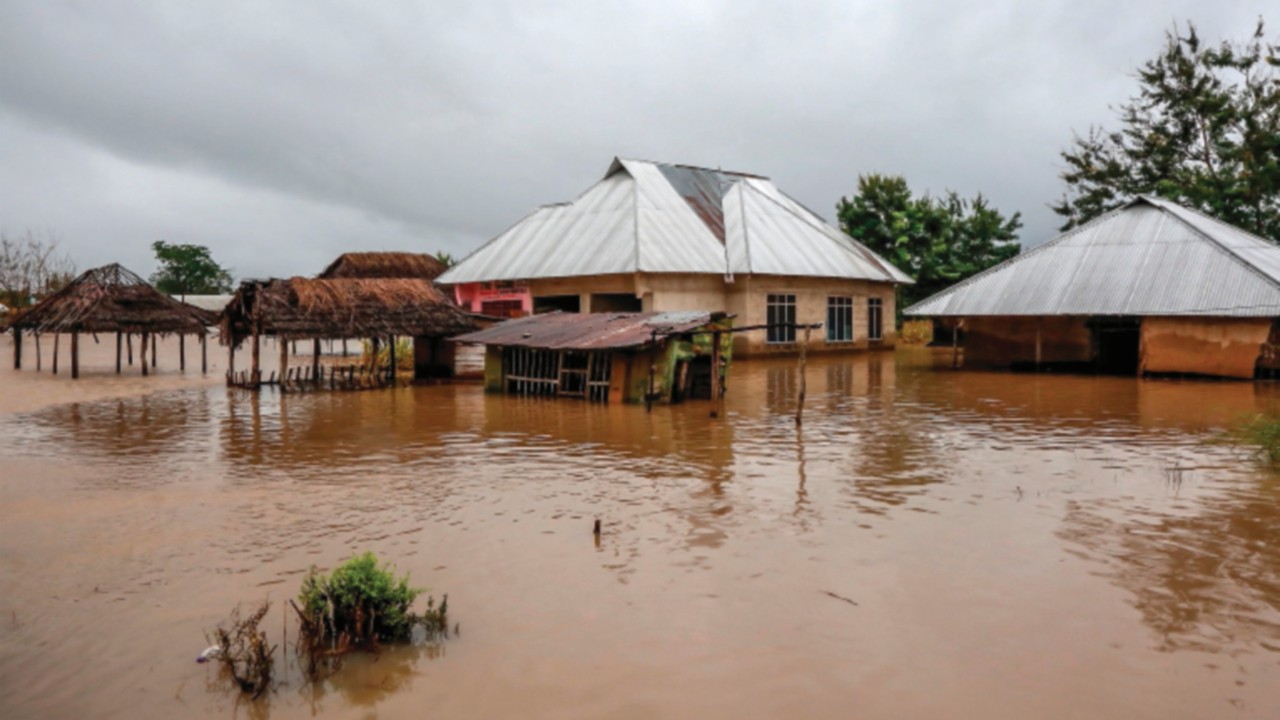 CORRECTION / Houses are covered under water in an area heavily affected by floods following ...