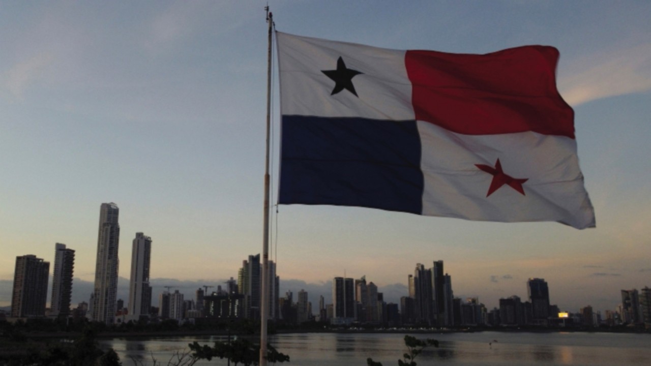 A drone view shows a Panamanian flag during sunset at a tourist area as Panamanians prepare for ...