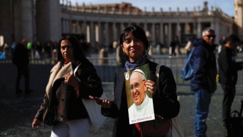 A person holds an image of Pope Francis as he continues his hospitalization, in St. Peter's Square, ... A person holds an image of Pope Francis as he continues his hospitalization, in St. Peter's Square, ...