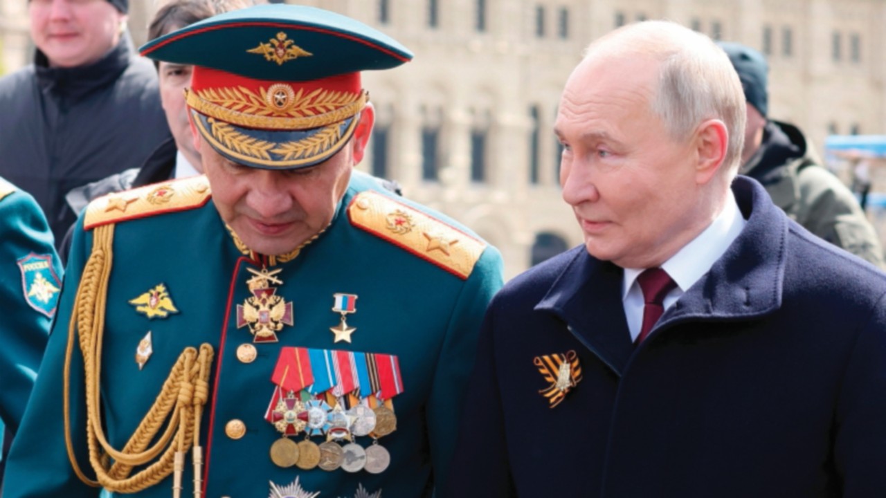 epa11335996 (FILE) - Russian President Vladimir Putin (R) with Defence Minister Sergei Shoigu (L) ...