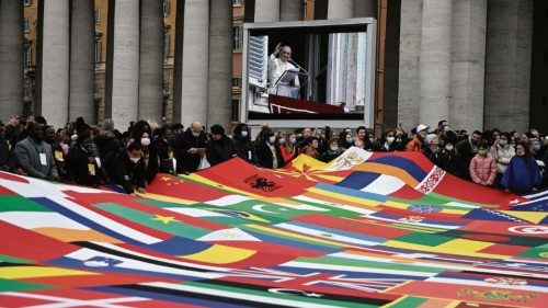 Faithfuls wave a giant patchwork with the flags of the world's countries as Pope Francis leads his ...