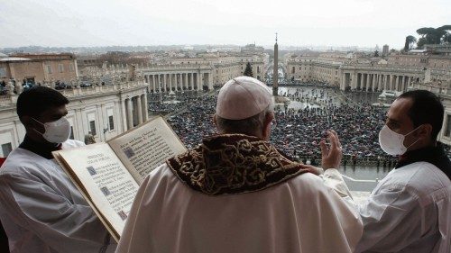 A handout photo taken and released by the Vatican Media shows Pope Francis delivering his Christmas ...