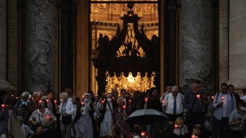People gather on the day of a mass to mark the 60th anniversary of the Second Vatican Council, at ...