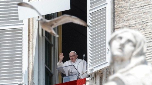 Pope Francis leads the Angelus, traditional Sunday's prayer, from the window of his office ...