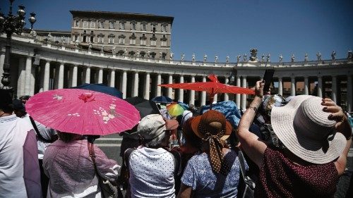 Faithfuls with umbrellas take shelter from the sun as they attend Pope FrancisÕ Sunday Angelus ...