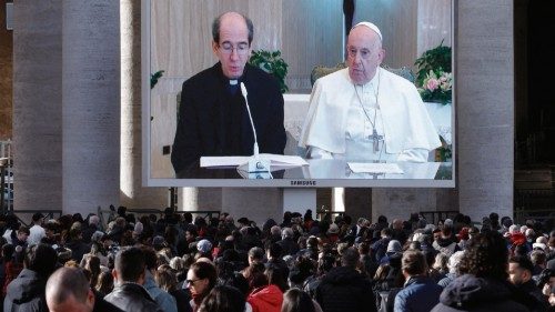 Monsignor Paolo Braida reads next to Pope Francis as they appear on a screen in St. Peter's Square, ... Monsignor Paolo Braida reads next to Pope Francis as they appear on a screen in St. Peter's Square, ...