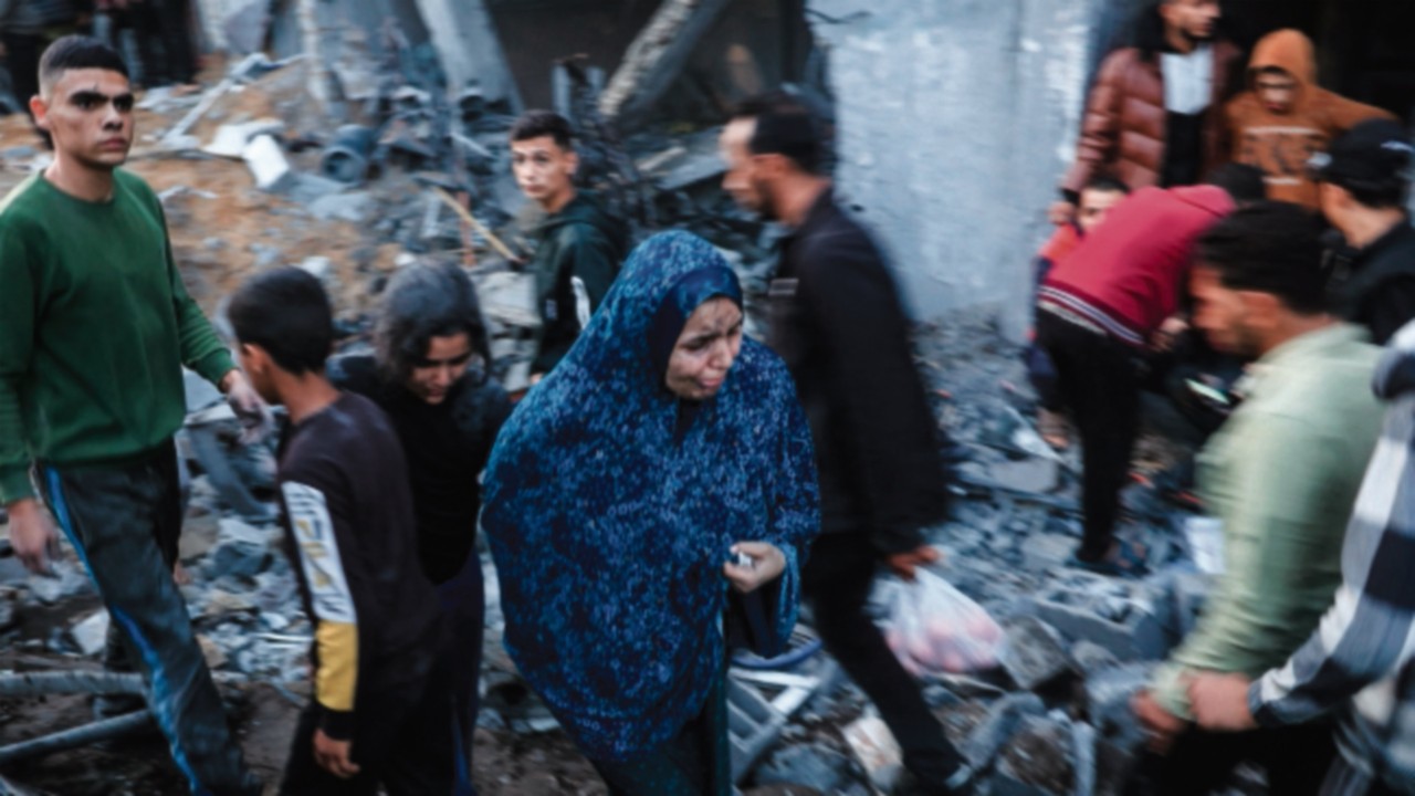 EDITORS NOTE: Graphic content / Palestinians check the damages after an Israeli strike in Rafah in ...
