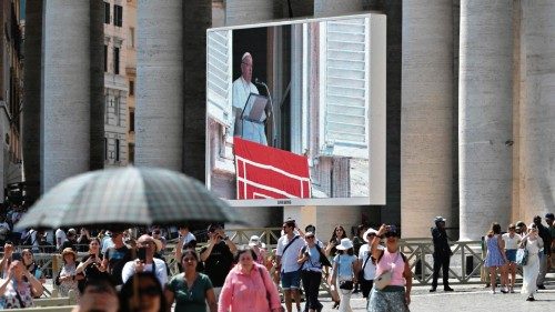 A giant screen broadcasts Pope Francis' address during the Sunday Angelus prayer, from the window of ... A giant screen broadcasts Pope Francis' address during the Sunday Angelus prayer, from the window of ...