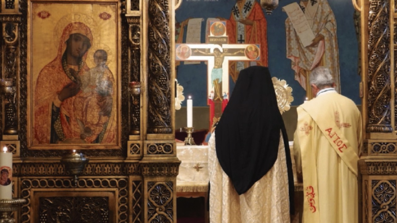 The Mass commences behind the iconostasis