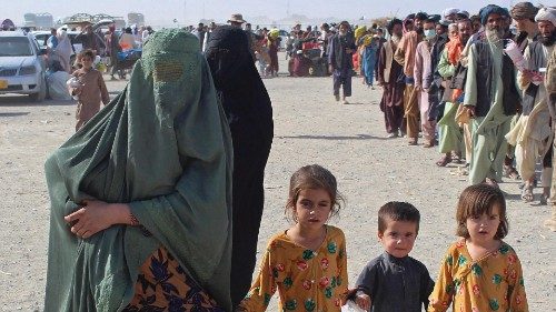 An Afghan family arrives at the Pakistan-Afghanistan border crossing point in Chaman on August 20, ...