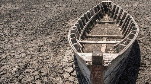 A wooden boat lies on the dry lake bottom at the dried inland Lake Chilwa's vacated Kachulu Harbour ...