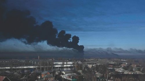 TOPSHOT - Black smoke rises from a military airport in Chuguyev near Kharkiv  on February 24, 2022. ...