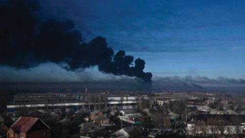 TOPSHOT - Black smoke rises from a military airport in Chuguyev near Kharkiv on February 24, 2022. ... TOPSHOT - Black smoke rises from a military airport in Chuguyev near Kharkiv on February 24, 2022. ...