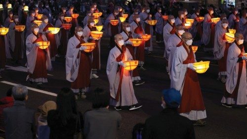 Buddhist monk march with lanterns during a Lotus Lantern parade in celebration of the upcoming ...