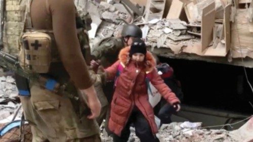 A child emerges from the Azovstal steel plant during UN-led evacuations, after nearly two months of ...