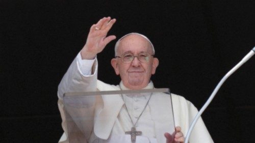 Pope Francis waves as he leads the Angelus prayer from his window, at the Vatican July 10, 2022.   ...