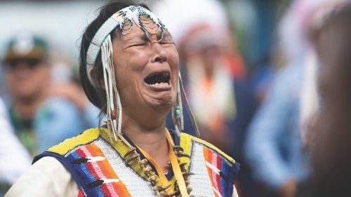 Sipihko, A Cree woman, weeps after she finished singing Oh Canada in Cree to Pope Francis at ...