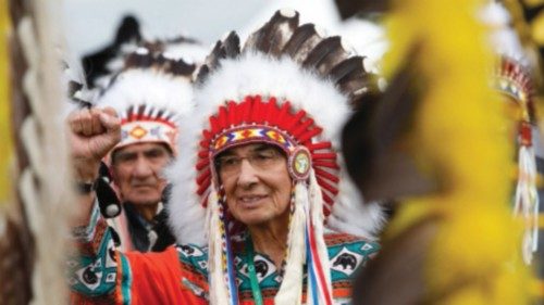 Chief Wilton Willie Littlechild raises his fist as Pope Francis meets with First Nations, Metis ...