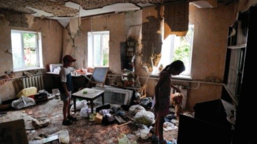 TOPSHOT - Children inspect a room damaged by the shelling in the town of Borodianka, near Kyiv on ...