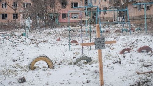 A view shows a grave of a local resident near buildings damaged by a Russian military strike, as ... A view shows a grave of a local resident near buildings damaged by a Russian military strike, as ...