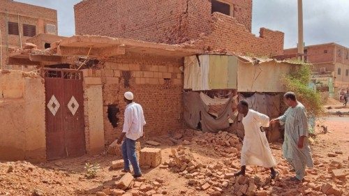 People check a damaged house in southern khartoum on June 12, 2023 as deadly shelling and gunfire ...