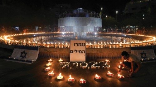 People gather and light candles to show solidarity with Israel and remember the victims following an ...