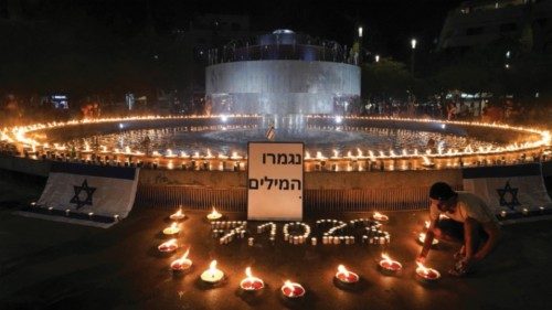 People gather and light candles to show solidarity with Israel and remember the victims following an ... People gather and light candles to show solidarity with Israel and remember the victims following an ...
