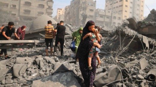 TOPSHOT - Palestinians evacuate the area following an Israeli airstrike on the Sousi mosque in Gaza ... TOPSHOT - Palestinians evacuate the area following an Israeli airstrike on the Sousi mosque in Gaza ...