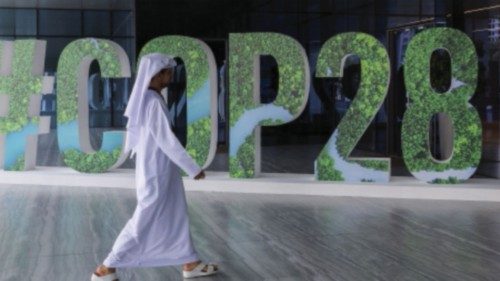 A person walks past a '#COP28' sign during The Changemaker Majlis, a one-day CEO-level thought ...
