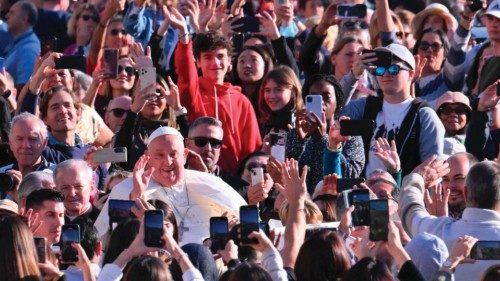 TOPSHOT - Pope Francis waves to the crowd from the popemobile as he arrives for the weekly general ...