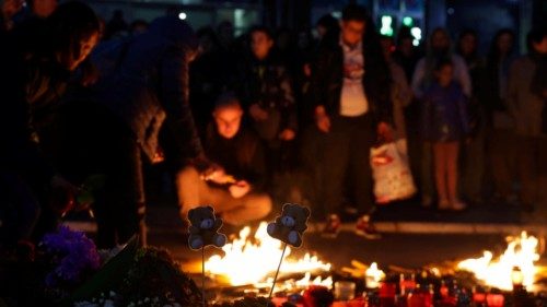 epa11697646 People light candles during the vigil for the victims of the collapse of the canopy at ... epa11697646 People light candles during the vigil for the victims of the collapse of the canopy at ...