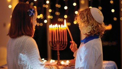 Kids celebrating Hanukkah. Jewish festival of lights. Children lighting candles on traditional ... Kids celebrating Hanukkah. Jewish festival of lights. Children lighting candles on traditional ...