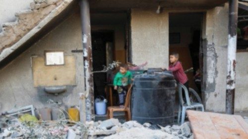 Palestinian boys look on at the site of an Israeli strike on a house, in Jabalia, northern Gaza ... Palestinian boys look on at the site of an Israeli strike on a house, in Jabalia, northern Gaza ...