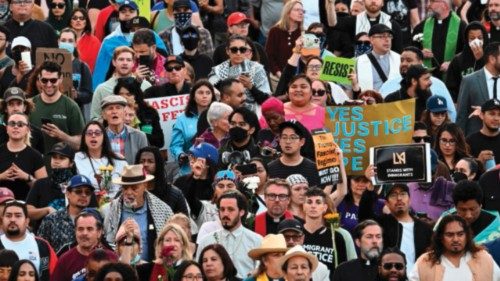 People attending a prayer vigil walk to the Federal Building in downtown Los Angeles as protests ... People attending a prayer vigil walk to the Federal Building in downtown Los Angeles as protests ...
