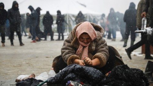 A woman washes clothing near the Belarusian-Polish border, in the Grodno region, Belarus November ... A woman washes clothing near the Belarusian-Polish border, in the Grodno region, Belarus November ...