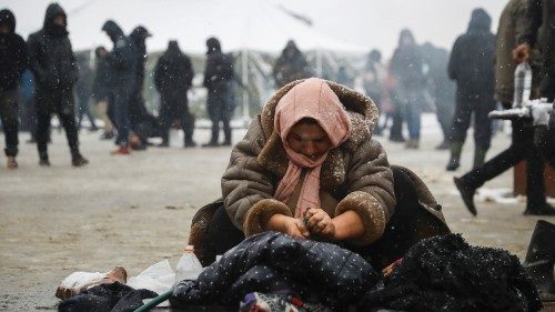 A woman washes clothing near the Belarusian-Polish border, in the Grodno region, Belarus November ...