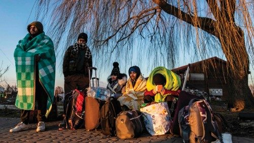 TOPSHOT - Refugees from Ukraine as seen at the border crossing in Medyka, eastern Poland on February ...