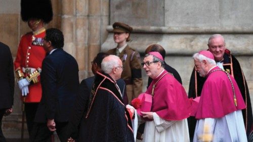 Representatives from the Vatican arrive to take their seats inside Westminster Abbey in London on ...