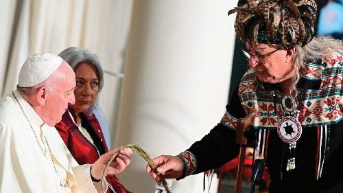 Pope Francis is presented a gift during a meeting with civil authorities, representatives of ... Pope Francis is presented a gift during a meeting with civil authorities, representatives of ...