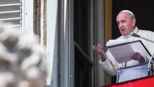 Pope Francis speaks from a window of the apostolic palace overlooking St. Peter's Square in the ...