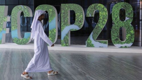 A person walks past a '#COP28' sign during The Changemaker Majlis, a one-day CEO-level thought ...