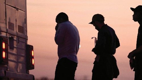 YUMA, ARIZONA - MAY 11: Immigrants seeking asylum, wait to board a bus to a U.S. Border Patrol ...