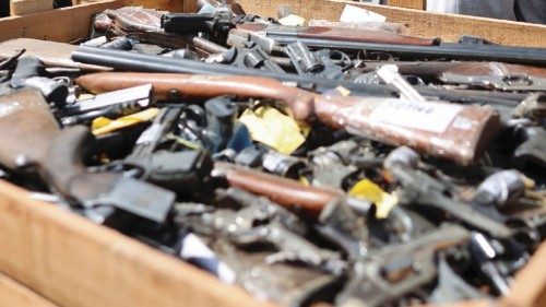 Argentina's Security Minister Patricia Bullrich looks at weapons seized from the city of Rosario and ...