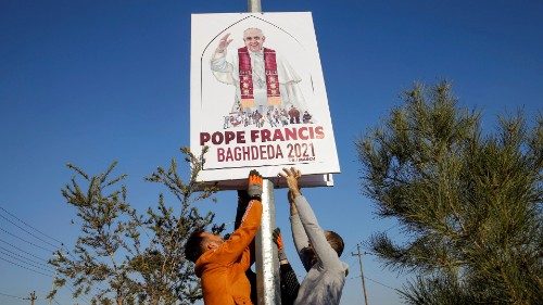 FILE PHOTO: Christians volunteers decorate streets with the pictures of Pope Francis, ahead of his ...