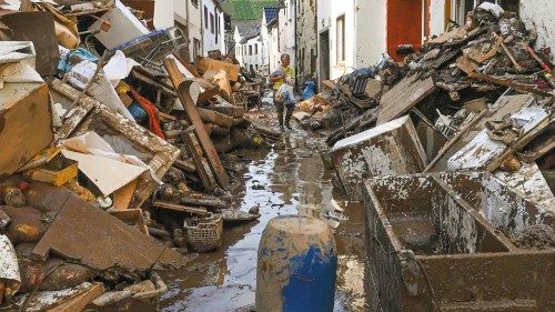 A  residents walks in a street full of debris and mud in the city of Dernau, western Germany, on ...