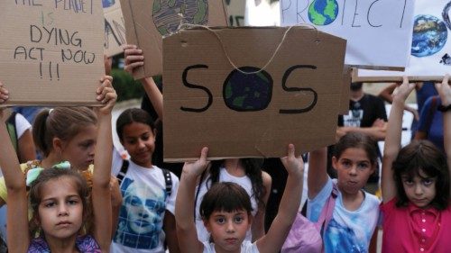FILE PHOTO: Children hold placards during a global climate change strike rally in Nicosia, Cyprus ... FILE PHOTO: Children hold placards during a global climate change strike rally in Nicosia, Cyprus ...