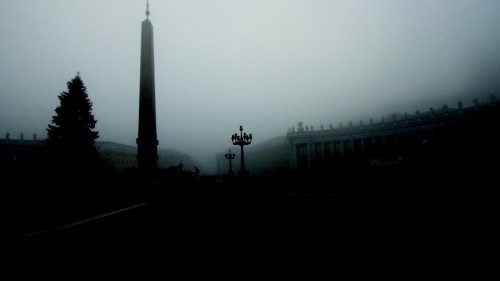 A nun walks amid fog over Saint Peter's square prior to Pope Francis' mass in St. Peter's Basilica ...