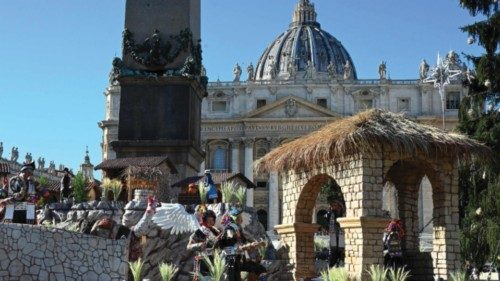 A photograph shows the Vatican's Christmas Tree and Nativity Scene in front of the St. Peter's ...