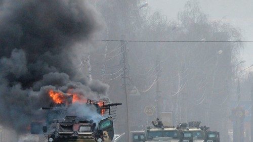 CORRECTION / TOPSHOT - This photograph taken on February 27, 2022 shows a Russian Armoured personnel ...